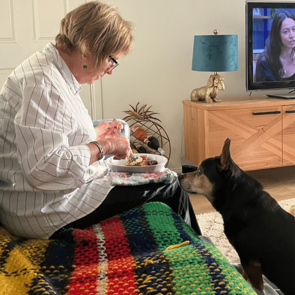 Boston keeps an eagle eye on his grandmum as she eats